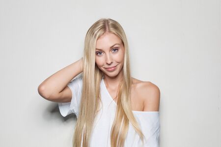 Portrait of a beautiful woman in white clothesの写真素材
