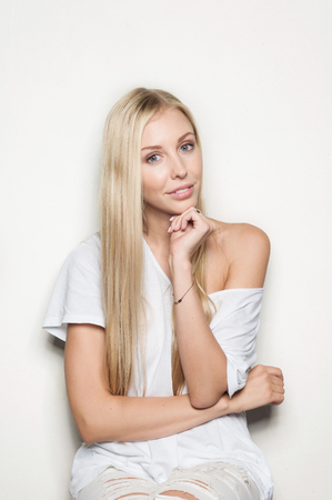 Portrait of a beautiful woman in white clothesの写真素材