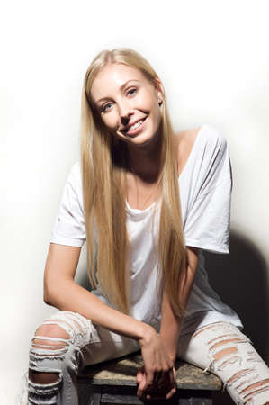 Portrait of a beautiful woman in white clothesの写真素材
