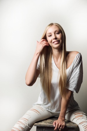 Portrait of a beautiful woman in white clothesの写真素材
