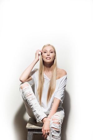 Portrait of a beautiful woman in white clothesの写真素材