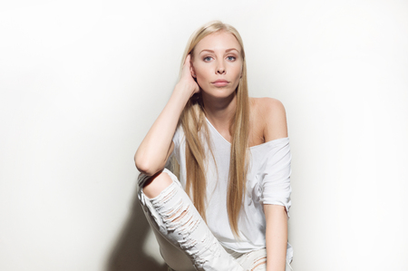 Portrait of a beautiful woman in white clothesの写真素材