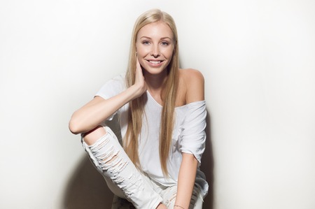 Portrait of a beautiful woman in white clothesの写真素材