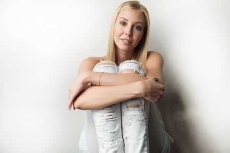 Portrait of a beautiful woman in white clothesの写真素材
