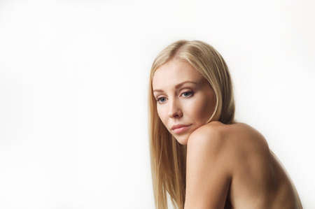 Portrait of a beautiful woman in white clothesの写真素材