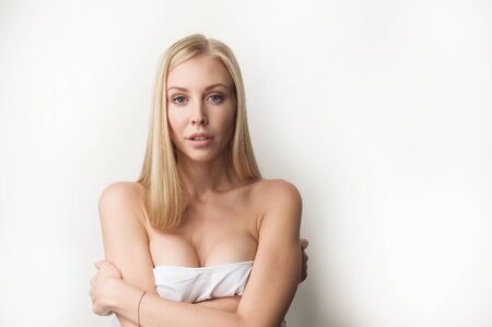 Portrait of a beautiful woman in white clothesの写真素材
