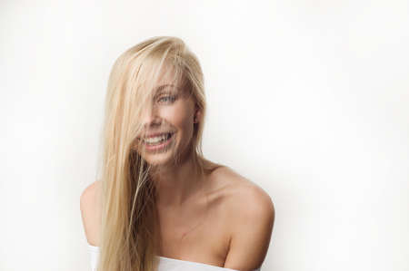 Portrait of a beautiful woman in white clothesの写真素材