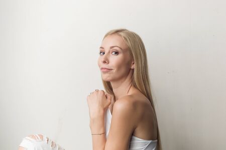Portrait of a beautiful woman in white clothesの写真素材