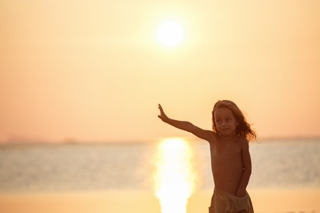 Handsome boy at sunsetの写真素材