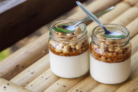 Glass jars with delicious yogurtの写真素材