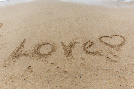 Word love on the sandの写真素材