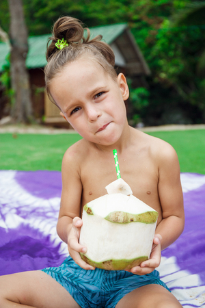 boy drinking coconutの写真素材