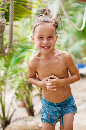 little boy having fun on the beachの写真素材