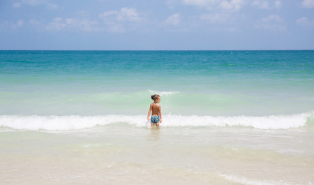little boy in the sea in Thailandの写真素材