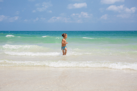 little boy in the sea in Thailandの写真素材