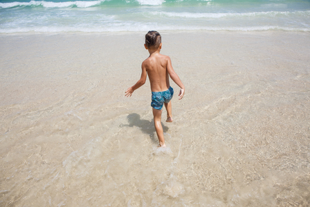 little boy in the sea in Thailandの写真素材