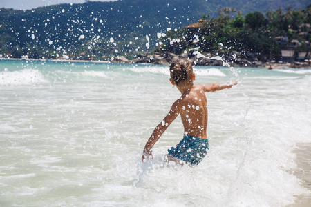 little boy in the sea in Thailandの写真素材