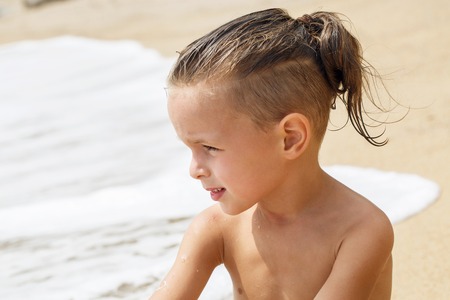 little boy in the sea in Thailandの写真素材