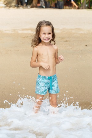 little boy in the sea in Thailandの写真素材