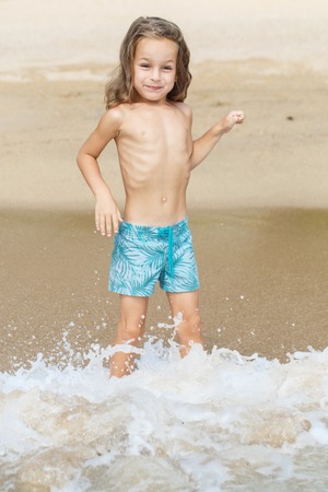 little boy in the sea in Thailandの写真素材