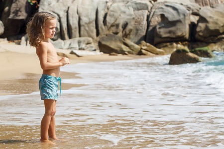 little boy in the sea in Thailandの写真素材