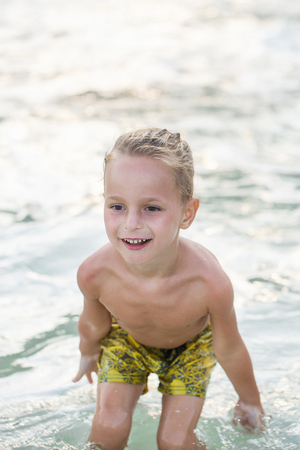 little boy in the sea in Thailandの写真素材