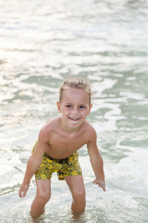 little boy in the sea in Thailandの写真素材