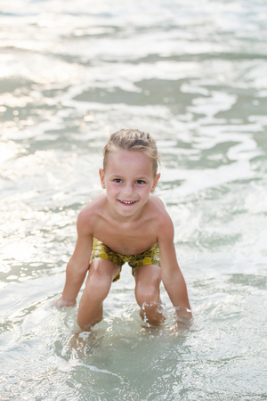 little boy in the sea in Thailandの写真素材