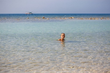little boy in the sea in Thailandの写真素材