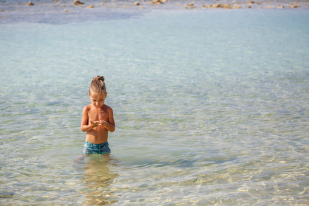 little boy in the sea in Thailandの写真素材