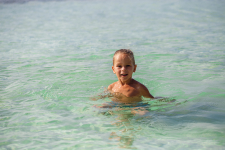 little boy in the sea in Thailandの写真素材