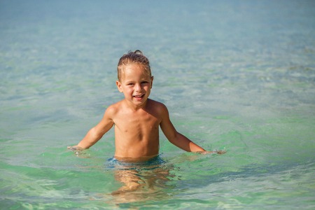 little boy in the sea in Thailandの写真素材