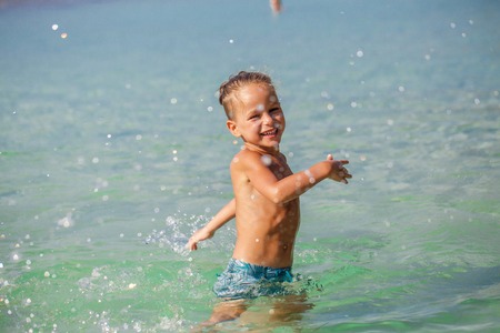 little boy in the sea in Thailandの写真素材