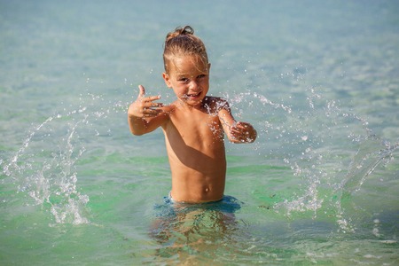 little boy in the sea in Thailandの写真素材
