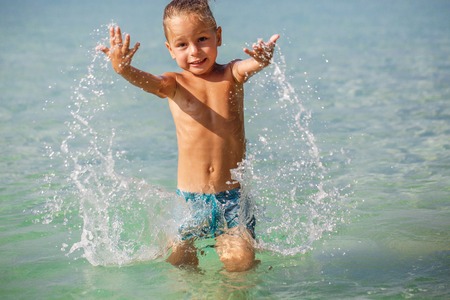 little boy in the sea in Thailandの写真素材