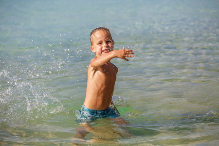 little boy in the sea in Thailandの写真素材