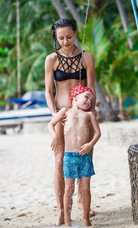 Mother with her son are taking showerの写真素材