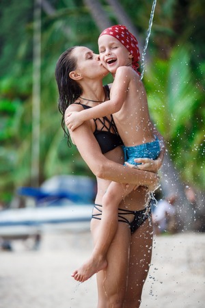 Mother with her son are taking showerの写真素材