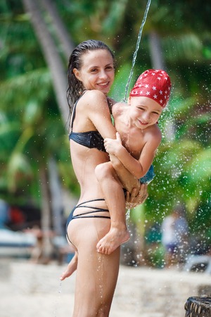 Mother with her son are taking showerの写真素材