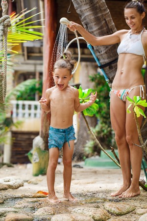 Mother with her son are taking showerの写真素材
