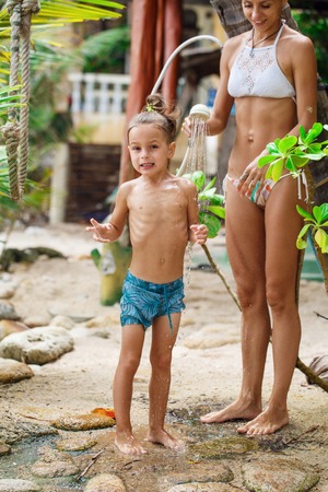 Mother with her son are taking showerの写真素材