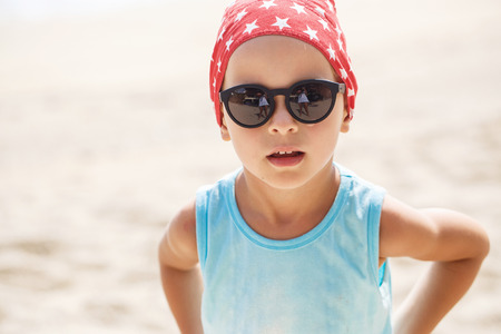 Portrait of a beautiful baby boy in sunglassesの写真素材