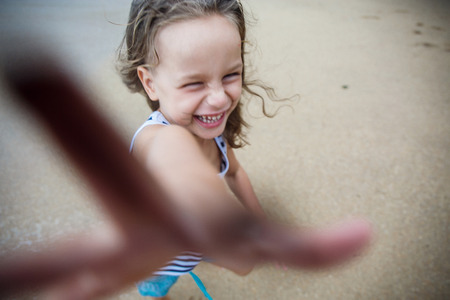 Cute boy is having fun on the beachの写真素材
