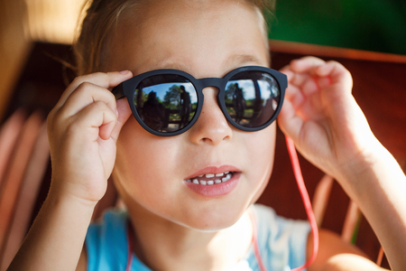Portrait of a beautiful baby boy in sunglassesの写真素材