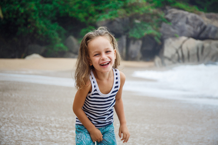 Cute boy is having fun on the beachの写真素材