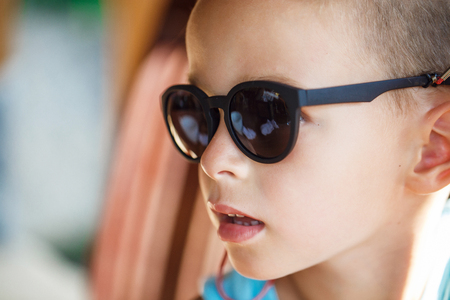 Portrait of a baby boy in sunglassesの写真素材