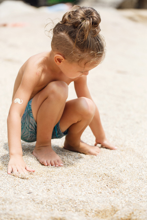 little boy built a sand castleの写真素材