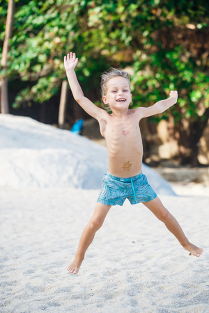 boy is having fun on the beachの写真素材