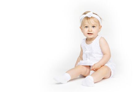 beautiful little girl all in white clothesの写真素材