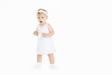 beautiful little girl all in white clothesの写真素材